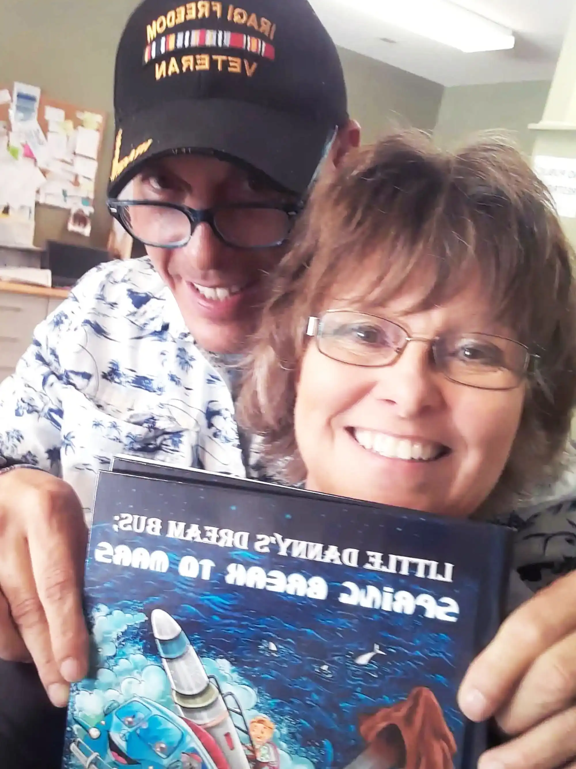 Going to the DMV and author David Haave shares his new book with community spirit; Boonville, MO, USA. -- David Haave